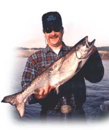 Bill Sargent of FishingChartersBC.com catches a beautiful fish.